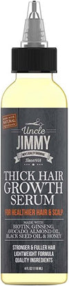 Bottle of UNCLE JIMMY THICK HAIR GROWTH SERUM with a black spray nozzle, yellow label, and text indicating it contains natural ingredients such as Rosemary, Seakale, Aloe Vera, and Ginkgo Biloba.